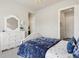 Comfortable bedroom with a dresser, and adjacent doorways at 863 Edenborn Pl, Castle Rock, CO 80104