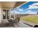 Inviting covered patio with seating, perfect for enjoying scenic views and outdoor dining at 863 Edenborn Pl, Castle Rock, CO 80104