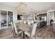 Open dining area with modern lighting fixtures seamlessly integrated with the gourmet kitchen at 863 Edenborn Pl, Castle Rock, CO 80104