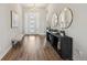 Bright entryway features wood floors, decor and a bench at 863 Edenborn Pl, Castle Rock, CO 80104