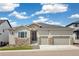 Charming home featuring stone accents, a three-car garage, and professionally landscaped front yard at 863 Edenborn Pl, Castle Rock, CO 80104
