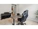 Modern home office with gaming chair, desk, piano and natural light at 863 Edenborn Pl, Castle Rock, CO 80104