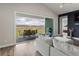 Bright living room with a sliding glass door opening to a patio, seamlessly blending indoor and outdoor living spaces at 863 Edenborn Pl, Castle Rock, CO 80104
