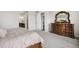Serene main bedroom boasts a stylish dresser, mirror, and a calming ambiance for restful nights at 863 Edenborn Pl, Castle Rock, CO 80104