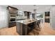 Spacious kitchen featuring a large island, modern appliances, and custom cabinetry at 6690 S Sheridan Blvd, Littleton, CO 80123