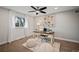 Bright home office featuring a desk, stylish decor, and natural light from a window at 6690 S Sheridan Blvd, Littleton, CO 80123