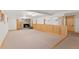 Spacious finished basement featuring a stone fireplace and carpet floors at 10522 Bayou Gulch Rd, Parker, CO 80134