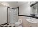 Bathroom featuring a black and white tile floor, glass shower, and custom fixtures at 10522 Bayou Gulch Rd, Parker, CO 80134
