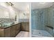 Modern bathroom with glass vessel sink, dark granite countertops, and mosaic tiled shower at 10522 Bayou Gulch Rd, Parker, CO 80134