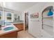 Bright bathroom featuring double sinks, mosaic tile accents, and ample storage space at 10522 Bayou Gulch Rd, Parker, CO 80134