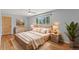 Bright bedroom features a cozy bed, matching nightstands, and a large window view at 10522 Bayou Gulch Rd, Parker, CO 80134