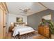 Elegant bedroom with a decorative ceiling, hardwood floors, and classic furnishings at 10522 Bayou Gulch Rd, Parker, CO 80134