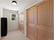 Bedroom with tan carpet, window and large closet with sliding doors at 10522 Bayou Gulch Rd, Parker, CO 80134