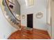 Grand foyer with hardwood floors, a staircase, and high ceilings with natural light at 10522 Bayou Gulch Rd, Parker, CO 80134