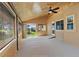 Bright sunroom with wood ceiling, ceiling fan and sliding glass doors that bring the outside in at 10522 Bayou Gulch Rd, Parker, CO 80134