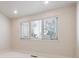 Bedroom with trim and a large window providing natural light at 1907 S Columbine St, Denver, CO 80210