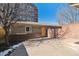 Charming house with brick accents and a fenced-in yard and front entry at 1907 S Columbine St, Denver, CO 80210