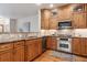 Gourmet kitchen features stone countertops, stainless appliances and custom wood cabinetry at 1907 S Columbine St, Denver, CO 80210
