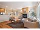 Open floor plan connects living room to the dining area, featuring hardwood floors and fireplace at 1907 S Columbine St, Denver, CO 80210