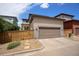 Home exterior features a two-car garage and a well-maintained yard at 9603 Dunning Cir, Highlands Ranch, CO 80126
