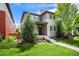 Charming two-story home featuring landscaped front yard, gray siding, and a welcoming porch perfect for relaxing at 9603 Dunning Cir, Highlands Ranch, CO 80126