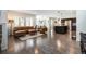 Spacious living room with hardwood floors, neutral tones, comfortable seating, and abundant natural light at 9603 Dunning Cir, Highlands Ranch, CO 80126
