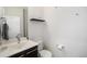 Simple powder room with modern fixtures, dark wood vanity, and minimalist décor at 9603 Dunning Cir, Highlands Ranch, CO 80126