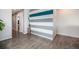 Room features a decorative wall with stripes, contemporary floors and lighting, exuding modern style at 9603 Dunning Cir, Highlands Ranch, CO 80126