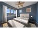 Inviting bedroom with ceiling fan, large window, and stylish decor at 190 Roslyn St # 802, Denver, CO 80230