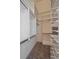 Walk-in closet with ample shelving and rod space for organization at 190 Roslyn St # 802, Denver, CO 80230