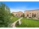 Landscaped courtyard with manicured lawns and brick townhomes, creating a peaceful and inviting community atmosphere at 190 Roslyn St # 802, Denver, CO 80230