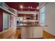 Well-lit kitchen featuring stainless steel appliances, island, and hardwood flooring at 190 Roslyn St # 802, Denver, CO 80230