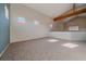 Unfurnished living room with vaulted ceiling and natural light, featuring multiple windows at 190 Roslyn St # 802, Denver, CO 80230