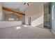 Spacious living room with vaulted ceiling, exposed beams, and natural light at 190 Roslyn St # 802, Denver, CO 80230