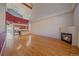 Spacious living area with hardwood floors and fireplace, open to kitchen and dining area; creating an airy ambiance at 190 Roslyn St # 802, Denver, CO 80230