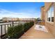 Cozy outdoor patio offers room to relax with potted plants and neighborhood views at 190 Roslyn St # 802, Denver, CO 80230