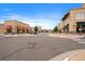 Commercial street view with storefronts, red awnings, sidewalks, and crosswalks at 190 Roslyn St # 802, Denver, CO 80230