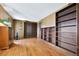 A bedroom with built-in shelving units and hardwood floors at 4380 Sandstone Dr, Monument, CO 80132