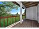 Outdoor deck area featuring wooden railings and scenic views of the surrounding landscape at 4380 Sandstone Dr, Monument, CO 80132