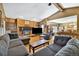 Cozy living room featuring a fireplace and open floor plan leading to dining room at 4380 Sandstone Dr, Monument, CO 80132
