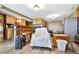 Cozy living room featuring a stone fireplace, comfortable seating, wood flooring, wet bar and modern lighting at 4380 Sandstone Dr, Monument, CO 80132
