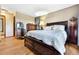 Bedroom with hardwood floors, natural light, and traditional furniture at 4380 Sandstone Dr, Monument, CO 80132