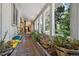 Relaxing sun room with a planter bed, large windows, and tile flooring at 4380 Sandstone Dr, Monument, CO 80132