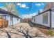 Exterior view of yard showcasing the garage and home at 4401 Quieto Ct, Denver, CO 80211