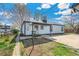 Cozy backyard featuring a small lawn, covered patio, and well-maintained landscaping around the perimeter at 4401 Quieto Ct, Denver, CO 80211