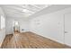 Basement area with wood-look floors and open access to the kitchenette at 4401 Quieto Ct, Denver, CO 80211