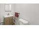 Bathroom featuring modern vanity, brushed nickel faucet, and sleek towel rack at 4401 Quieto Ct, Denver, CO 80211