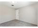 Neutral bedroom featuring gray carpet, fresh paint, and overhead lighting at 4401 Quieto Ct, Denver, CO 80211