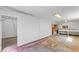 Large garage area with workbench, utility sink, and laminate flooring at 4401 Quieto Ct, Denver, CO 80211