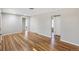 Hardwood floors, large windows, and neutral paint are visible in the living room at 4401 Quieto Ct, Denver, CO 80211